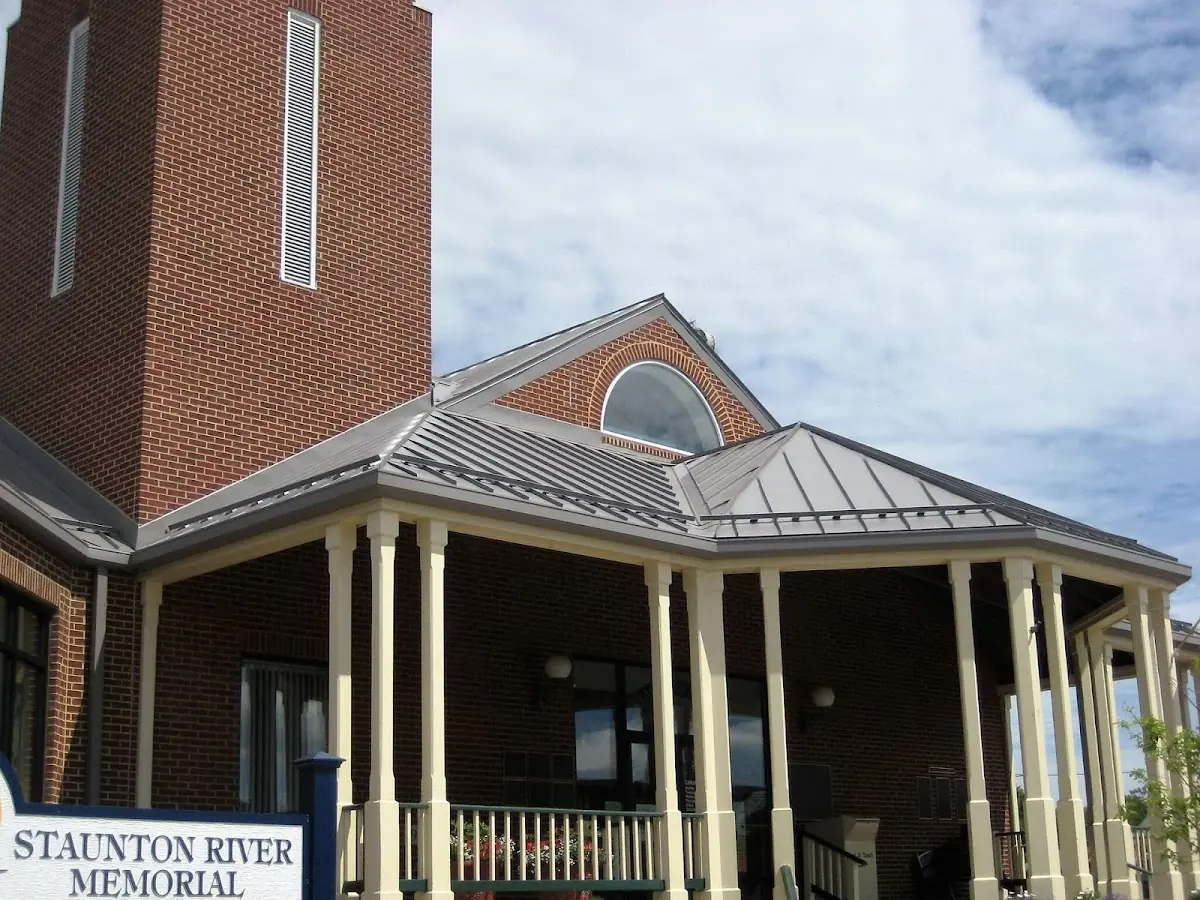 Skilled roofing craftsmen working on a residential roof in Tariffville Center